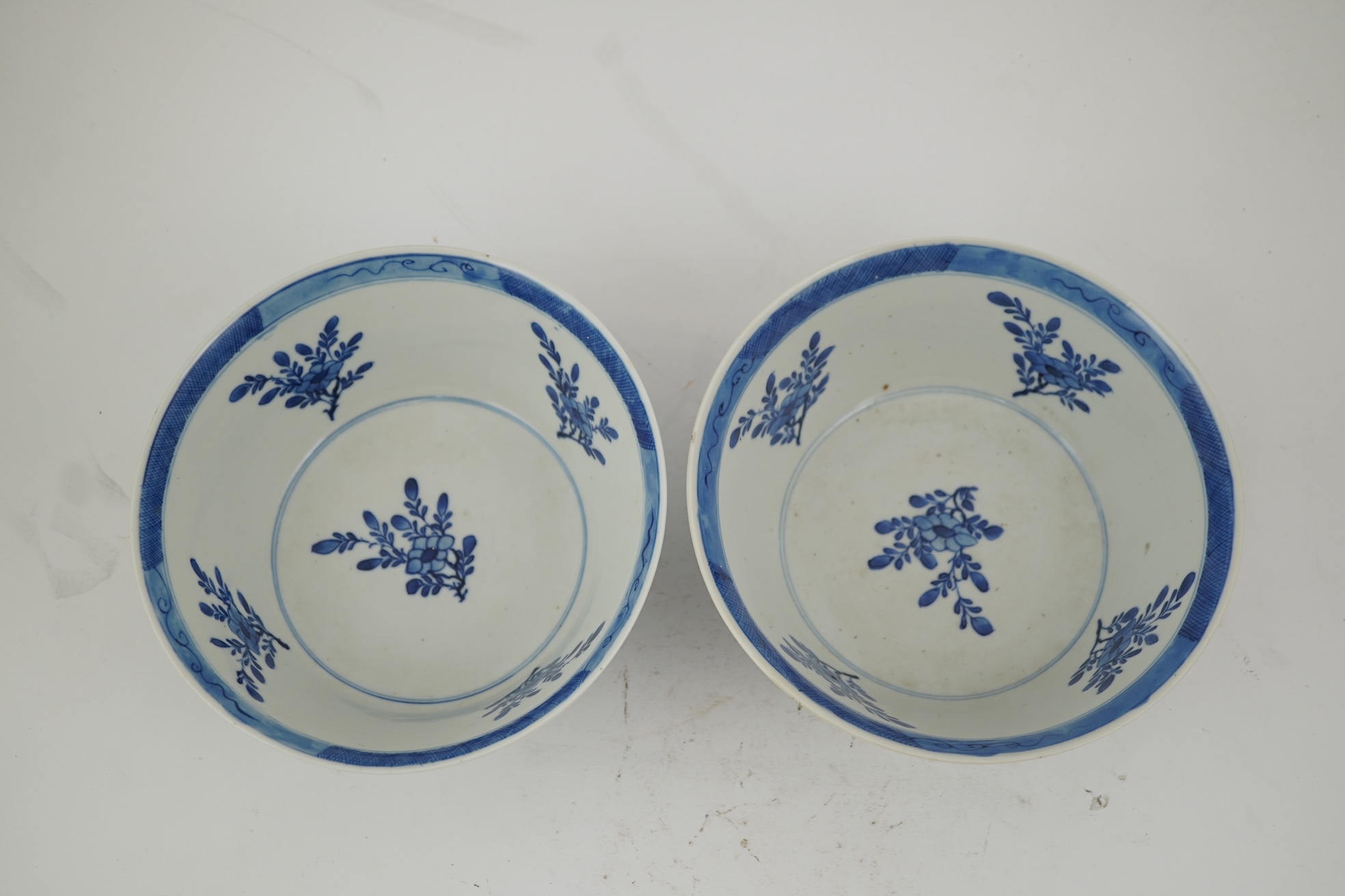 A pair of Chinese blue and white bowls, Kangxi four character mark, 19th century